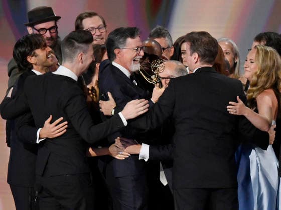 Stephen Colbert (C) holds the Emmy as crew including Ariel Dumas, Opus Moreschi, Lauren Marcello, Sara Vilkomerson, Gabriel W Gronli, Stephen Colbert, Paul Dinello, Bjoern Stejskal, Tanya Michnevich Bracco, Matt Lappin, Michael R Brumm and Aaron Cohen accept the Outstanding Variety Series Award for The Late Show with Stephen Colbert on stage during the 78th annual Primetime Emmy Awards at the Peacock Theater in Los Angeles on Monday, September 14, 2026. LAP20260914905 JIMxRUYMEN