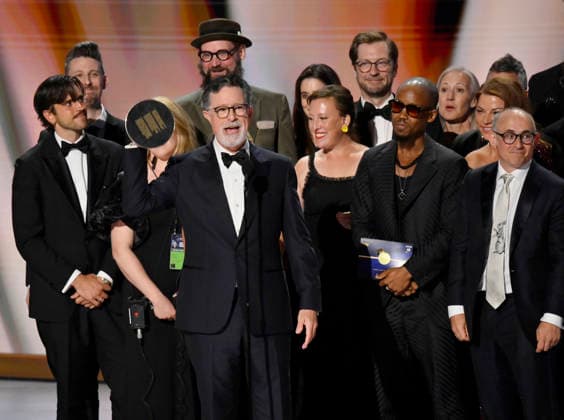 Stephen Colbert (C) holds the Emmy as crew including Ariel Dumas, Opus Moreschi, Lauren Marcello, Sara Vilkomerson, Gabriel W Gronli, Stephen Colbert, Paul Dinello, Bjoern Stejskal, Tanya Michnevich Bracco, Matt Lappin, Michael R Brumm and Aaron Cohen accept the Outstanding Variety Series Award for The Late Show with Stephen Colbert on stage during the 78th annual Primetime Emmy Awards at the Peacock Theater in Los Angeles on Monday, September 14, 2026. LAP20260914908 JIMxRUYMEN