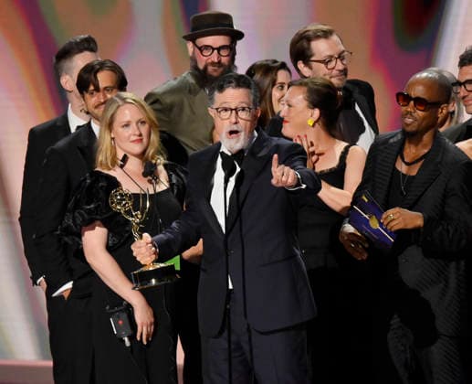 Stephen Colbert (C) holds the Emmy as crew including Ariel Dumas, Opus Moreschi, Lauren Marcello, Sara Vilkomerson, Gabriel W Gronli, Stephen Colbert, Paul Dinello, Bjoern Stejskal, Tanya Michnevich Bracco, Matt Lappin, Michael R Brumm and Aaron Cohen accept the Outstanding Variety Series Award for The Late Show with Stephen Colbert on stage during the 78th annual Primetime Emmy Awards at the Peacock Theater in Los Angeles on Monday, September 14, 2026. LAP20260914912 JIMxRUYMEN