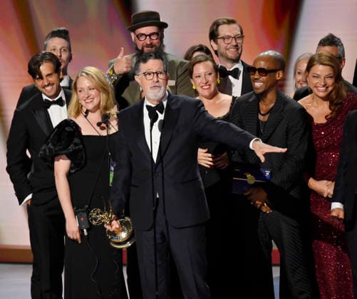 Stephen Colbert (C) holds the Emmy as crew including Ariel Dumas, Opus Moreschi, Lauren Marcello, Sara Vilkomerson, Gabriel W Gronli, Stephen Colbert, Paul Dinello, Bjoern Stejskal, Tanya Michnevich Bracco, Matt Lappin, Michael R Brumm and Aaron Cohen accept the Outstanding Variety Series Award for The Late Show with Stephen Colbert on stage during the 78th annual Primetime Emmy Awards at the Peacock Theater in Los Angeles on Monday, September 14, 2026. LAP20260914913 JIMxRUYMEN