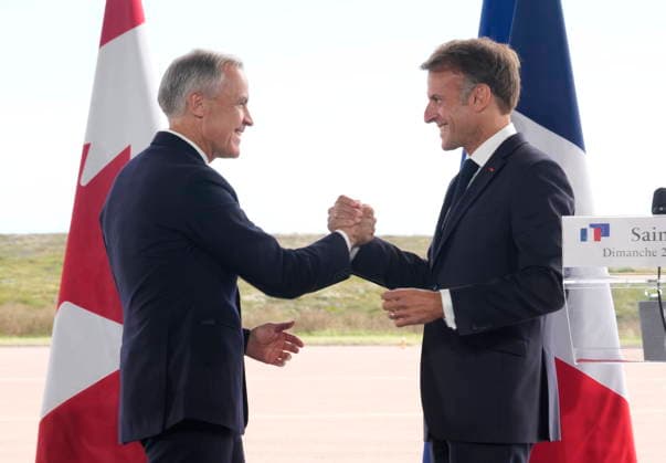 September 20, 2026, Saint-Pierre, France: French President Emmanuel Macron, right, and ..Prime Minister Mark Carney embrace after delivering remarks in Saint-Pierre, Saint-Pierre-et-Miquelon, a French territory 20 kilometres off the southern coast of Newfoundland, on Sunday, Sept. 20, 2026. Saint-Pierre France - ZUMAc35_ 20260920_zaf_c35_068 Copyright: xAdrianxWyldx