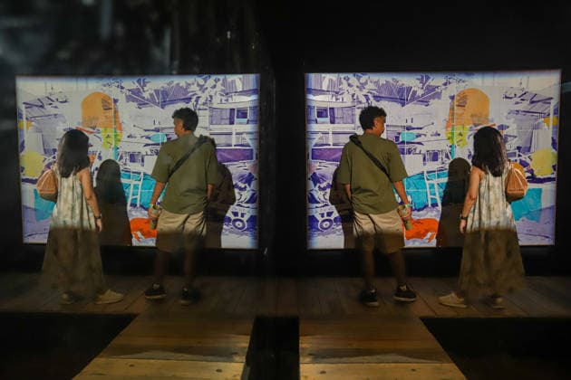 September 20, 2026, Surabaya, East Java, Indonesia: Visitors observe contemporary artworks at the ArtSubs 2026 exhibition at Balai Pemuda, Surabaya, East Java, Indonesia, on September 20, 2026. Titled border, threshold, beyond, the art exhibition features 500 works by 113 artists from across Indonesia, serving as a response to the public s need for a space of contemplation, reflection, and entertainment. Surabaya Indonesia - ZUMAp290 20260920_zip_p290_031 Copyright: xRendyxAgungxPrakosox