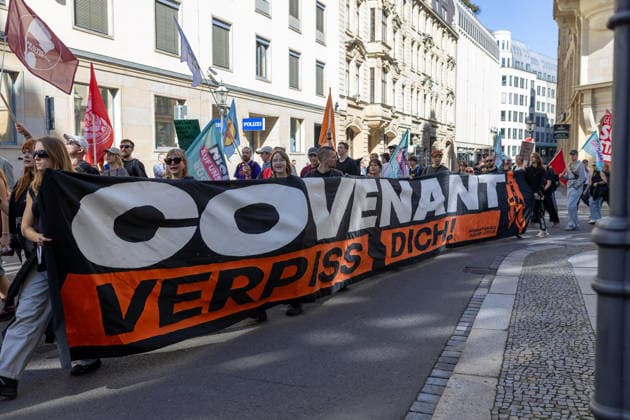 September 26, 2026, Leipzig, Saxony, Germany: Demonstrators participate in an Unko¼rzbar rally in Leipzig, Germany, on September 26, 2026, protesting cuts to social services and criticizing government spending priorities. Among the signs displayed during the demonstration were messages opposing increased investment in the arms industry and criticizing the Covenant military technology project in Leipzig. Protesters carried banners and placards calling for greater investment in social services and addressing issues including public spending, employment, pensions, healthcare and military expenditure. The demonstration took place in central Leipzig as part of the wider Unko¼rzbar campaign against cuts to social services. Leipzig Germany - ZUMAc291 20260926_zip_c291_010 Copyright: xMariaxCastrox