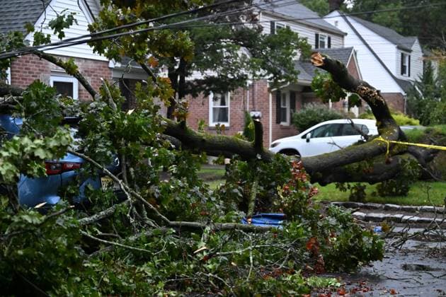 September 27, 2026, Ridgewood, New Jersey, USA: A tree is seen uprooted with wires down outside of a home on Gilbert Street during a nor easter storm in Ridgewood, New Jersey, United States, on Sunday, September 27, 2026. Heavy rain and strong winds battered the northeastern United States as an unusually powerful autumn storm intensified, forcing the cancellation of hundreds of flights and leaving tens of thousands of people without power. New York, Boston and Philadelphia were among the areas affected by the storm, as authorities warned of potential major flooding and road closures. Ridgewood USA - ZUMAs197 20260927_aaa_s197_002 Copyright: xKylexMazzax