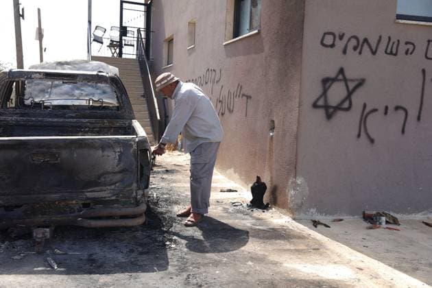 September 28, 2026, Ramallah, Palestine, State of: DEIR ABU MASHAâ€⠢AL, PALESTINE †SEPTEMBER 28, 2026: Israeli settlers attacked the village of Deir Abu Mashâ€⠢al, northwest of Ramallah, during the early hours of the morning, according to local sources. During the attack, settlers set fire to a vehicle belonging to Ahmed Shehadeh Zahran, also known as Abu Zaher, and spray-painted slogans on the walls of his home. The incident is part of a series of reported settler attacks affecting Palestinian communities in the occupied West Bank. Ramallah Palestine, State of - ZUMAq101 20260928_zna_q101_014 Copyright: xSalmanxMohsenxAlkhatibx