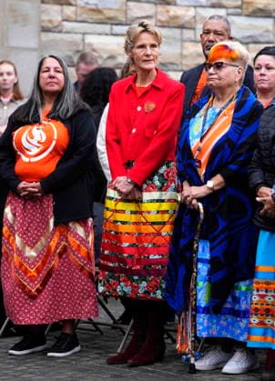 September 30, 2026, Ottawa, On, CAN: Diana Fox Carney, wife of Prime Minister Mark Carney, wears a ribbon skirt as she stands with Stephanie Scott, executive director of the National Centre for Truth and Reconciliation, left, and Residential School Survivor Jacquie Bouvier, right, during the re-raising of the Survivor s Flag ceremony on Parliament Hill in Ottawa, on National Day for Truth and Reconciliation, Wednesday, Sept. 30, 2026. Ottawa CAN - ZUMAc35_ 20260930_zaf_c35_007 Copyright: xJustinxTangx