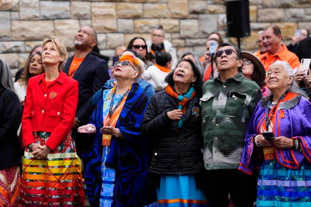 September 30, 2026, Ottawa, On, CAN: Residential School Survivor Jacquie Bouvier, second left, holds out her hands as she watches the Survivor s Flag rise on Parliament Hill with Diana Fox Carney, wife of Prime Minister Mark Carney, left, and other Residential School Survivors during a ceremony in Ottawa, on National Day for Truth and Reconciliation, Wednesday, Sept. 30, 2026. Ottawa CAN - ZUMAc35_ 20260930_zaf_c35_008 Copyright: xJustinxTangx