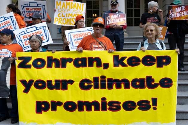 September 30, 2026, New York, New York, USA: Environmental advocates rally on the City Hall steps calling for Mayor Mamdani to keep his campaign promises to decarbonize New York City. Participants hold a banner that reads Zohran, keep your climate promises. Organizers call for the mayor to close the loophole in NYCâ€⠢s primary climate law, Local Law 97, to invest in green healthy public schools, fight fossil fuel infrastructure and fracked gas power plants. Participating organizations are Food & Water Watch, ALIGN, TREEage, NYPIRG, Rise & Resist, New York Communities for Change, Sunrise Movement NYC, Climate Defenders, Climate Defiance and Hot Girls Organize. New York USA - ZUMAr174 20260930_znp_r174_008 Copyright: xGinaxMxRandazzox
