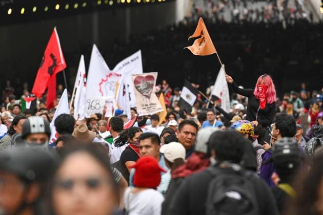 October 2, 2026: TO-45322-MEXICO , October 2, 2026. Student leaders from 1968 marched alongside students from various public universities, feminist collectives, "searching mothers," and Indigenous people from diverse regions to commemorate the anniversary of the Tlatelolco Massacre. They chanted slogans such as "No forgiveness, no forgetting," "Death to the State," and "It was the military." They marched along various avenues in the Mexican capital, concluding their rally at the Z& xf3;calo plaza, where clashes broke out with police stationed behind the barriers guarding the National Palace. In Mexico City. Clasos.com.mx - ZUMAcs4_ 20261002_faa_cs4_150 Copyright: xJavierxLiraxOterox
