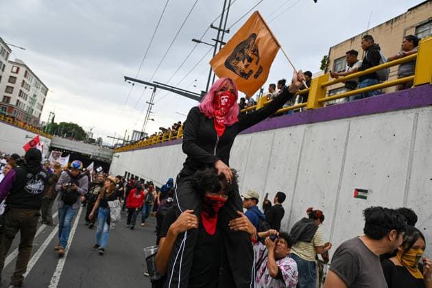 October 2, 2026: TO-45322-MEXICO , October 2, 2026. Student leaders from 1968 marched alongside students from various public universities, feminist collectives, "searching mothers," and Indigenous people from diverse regions to commemorate the anniversary of the Tlatelolco Massacre. They chanted slogans such as "No forgiveness, no forgetting," "Death to the State," and "It was the military." They marched along various avenues in the Mexican capital, concluding their rally at the Z& xf3;calo plaza, where clashes broke out with police stationed behind the barriers guarding the National Palace. In Mexico City. Clasos.com.mx - ZUMAcs4_ 20261002_faa_cs4_138 Copyright: xJavierxLiraxOterox