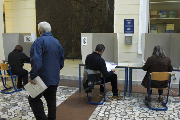 Voters cast ballots in Sarajevo as Bosnia and Herzegovina holds general elections SARAJEVO, BOSNIA AND HERZEGOVINA - OCTOBER 04: Voters cast their ballots as polling stations open for the 2026 General Elections in Sarajevo, Bosnia and Herzegovina on October 04, 2026. The nationwide vote features the inaugural use of new electoral technologies, including biometric voter identification, optical ballot scanners, and automated result transmission systems. Citizens are voting to elect members of the tripartite Presidency of Bosnia and Herzegovina, deputies to the Parliamentary Assembly, the Federation of BiH Parliament, the President and Vice Presidents of Republika Srpska, the National Assembly of Republika Srpska, and cantonal assemblies. Sami Copyright: x2026xAnadoluxSamirxJordamovicx