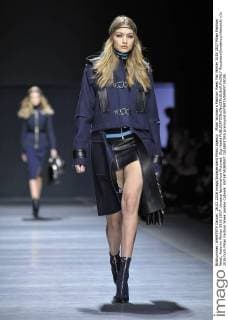 Gigi Hadid with bust flash at Versace fashion show during Milan Fashion Week