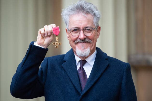 Griffith Rhys Jones presents his OBE after the award ceremony at Buckingham Palace in London