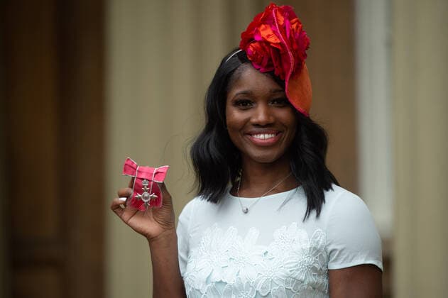 Ama Agbeze with her MBE after the award ceremony at Buckingham Palace in London
