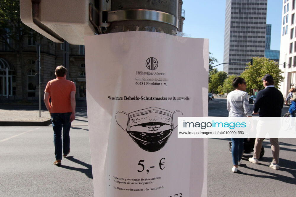 Stop at a traffic light pole with a sales offer of handmade makeshift cotton masks in the city centre of Frankfurt, Hesse, Germany