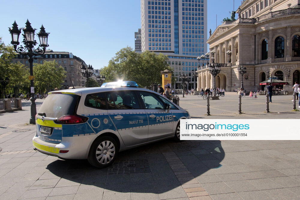 On the occasion of the corona crisis, a police patrol of the Hesse State Police checks the observance of the contact prohibitions and minimum distances on the Opernplatz in downtown Frankfurt, Hesse, Germany