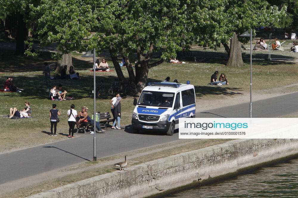 On the occasion of the corona crisis, a police patrol of the Hessian state police checks the observance of the contact prohibitions and minimum distances on the bank promenade on the banks of the Main in the city centre of Frankfurt, Hesse, Germany