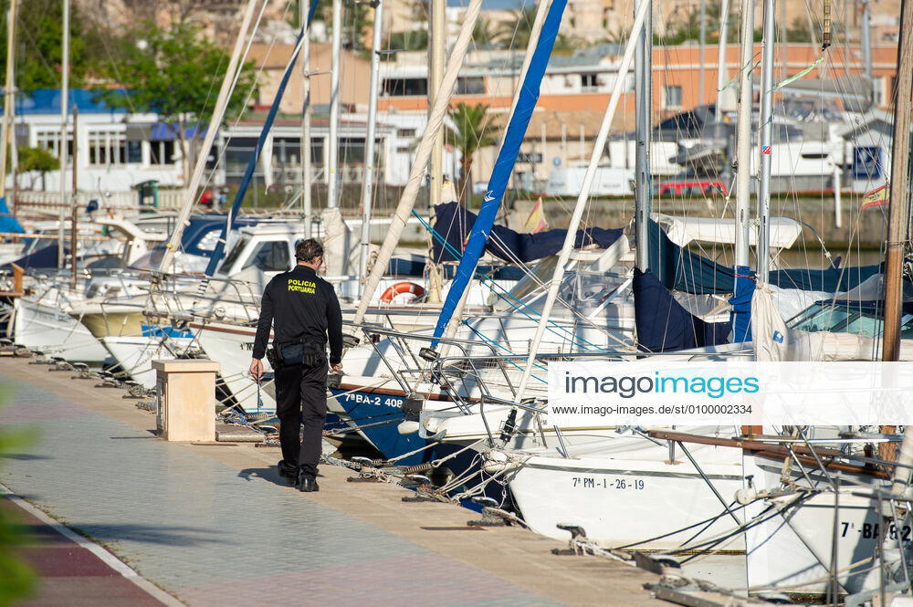 20200426 Children go out of the Home in Mallorca during Corona Lock down PALMA DE MALLORCA, SPAIN APRIL 26 2020 Port Police Offcier controls the moorings at Palma Port at Children go out of the Home in Mallorca during Corona Lock down on April 26, 2020 in Palma de Mallorca, Palma de Mallorca Baleares Spain