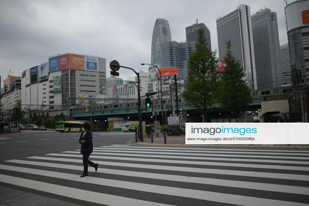 A woman wearing face mask walk across the street in Tokyo amid concerns of the COVID-19 coronavirus on Monday, April 27, 2020. Japanese Prime Minister Shinzo Abe declared a nationwide State of Emergency last week urging people to stay home to prevent the spreading of the coronavirus throughout the country. (Photo: Richard Atrero de Guzman AFLO) (125743187)