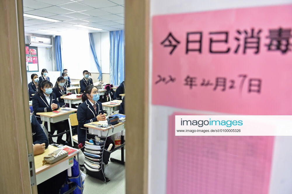 (200427) -- BEIJING, April 27, 2020 -- Students are in class at a classroom with notice showing the disinfection information at the entrance at Guangqumen Middle School in Beijing, capital of China, April 27, 2020. Senior high schools in Beijing on Monday restarted classes for seniors, who will take the national college entrance exam on July 7-10. ) CHINA-BEIJING-STUDENTS-BACK TO SCHOOL (CN) ChenxZhonghao