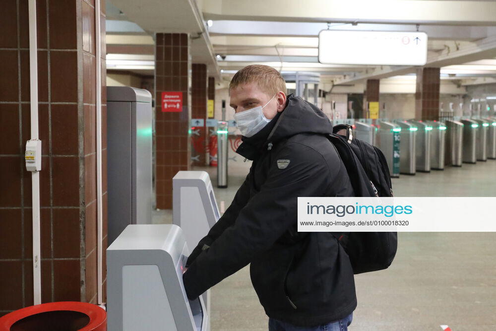 A commuter in a face mask uses a contactless hand sanitiser machine at the entrance to a deserted Komsomolskaya Station of the Moscow Underground (metro), during the pandemic of the novel coronavirus disease (COVID-19). Since 30 March, Moscow has been on lockdown. On 13 April 2020, the Moscow government introduced a digital permit system aimed at further restricting movement. Under the scheme, which became mandatory on 15 April, people need to apply for permits to travel on a vehicle or public transport around the city. As of 27 April 2020, Russia has reported more than 87,300 confirmed cases of the novel coronavirus infection, with more than 45,300 confirmed cases in Moscow. Vladimir Gerdo TASS TS0D7326