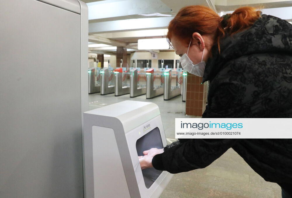 A commuter in a face mask uses a contactless hand sanitiser machine at the entrance to a deserted Komsomolskaya Station of the Moscow Underground (metro), during the pandemic of the novel coronavirus disease (COVID-19). Since 30 March, Moscow has been on lockdown. On 13 April 2020, the Moscow government introduced a digital permit system aimed at further restricting movement. Under the scheme, which became mandatory on 15 April, people need to apply for permits to travel on a vehicle or public transport around the city. As of 27 April 2020, Russia has reported more than 87,300 confirmed cases of the novel coronavirus infection, with more than 45,300 confirmed cases in Moscow. Vladimir Gerdo TASS TS0D7347