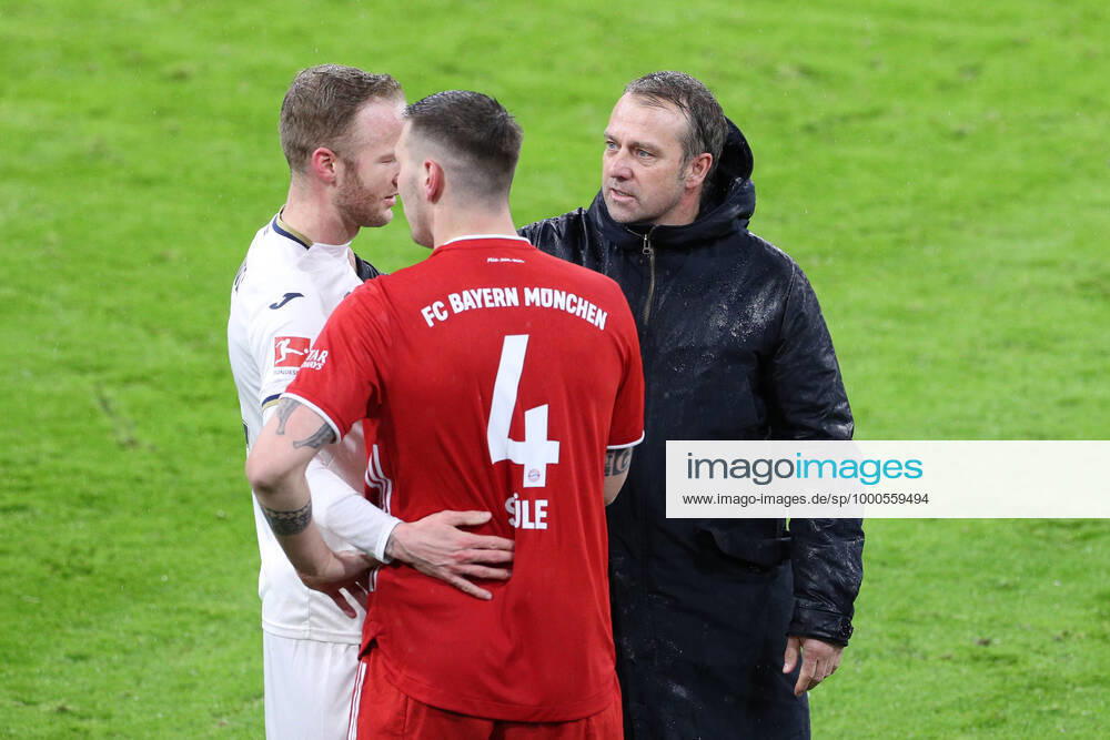 FC Bayern Muenchen vs TSG 1899 Hoffenheim, 1 Bundesliga, 19 Spieltag, 30 01 2021 l r Kevin Vogt 22 TSG 1899 Hoffenheim , Niklas Suele 4 FC Bayern Muenchen , Head coach Hansi Flick FC Bayern Muenchen after end of match, FC Bayern Muenchen vs TSG 1899 Hoffenheim, 1 Bundesliga, 19 Spieltag, 30 01 2021, Foto Christian Kolbert kolbert press Pool Editorial Use ONLY DFL regulations prohibit any use of photographs as image sequences and or quasi video National and International News Agencies OUT München Allianz Arena Bayern Deutschland Poolfoto Christian Kolbert kolbert-press Pool ,