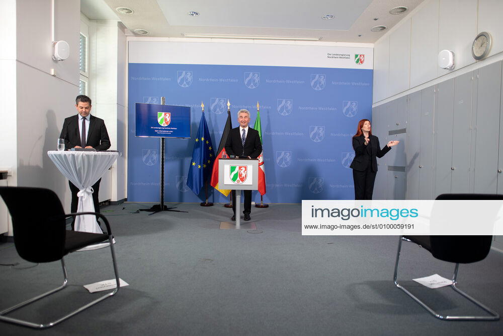 Andreas Pinkwart FDP , Minister of Economic Affairs of North Rhine-Westphalia, speaks at a press conference A sign language interpreter also translates The state government reports on the current situation and the measures taken by the state government in the context of the Corona pandemic xx