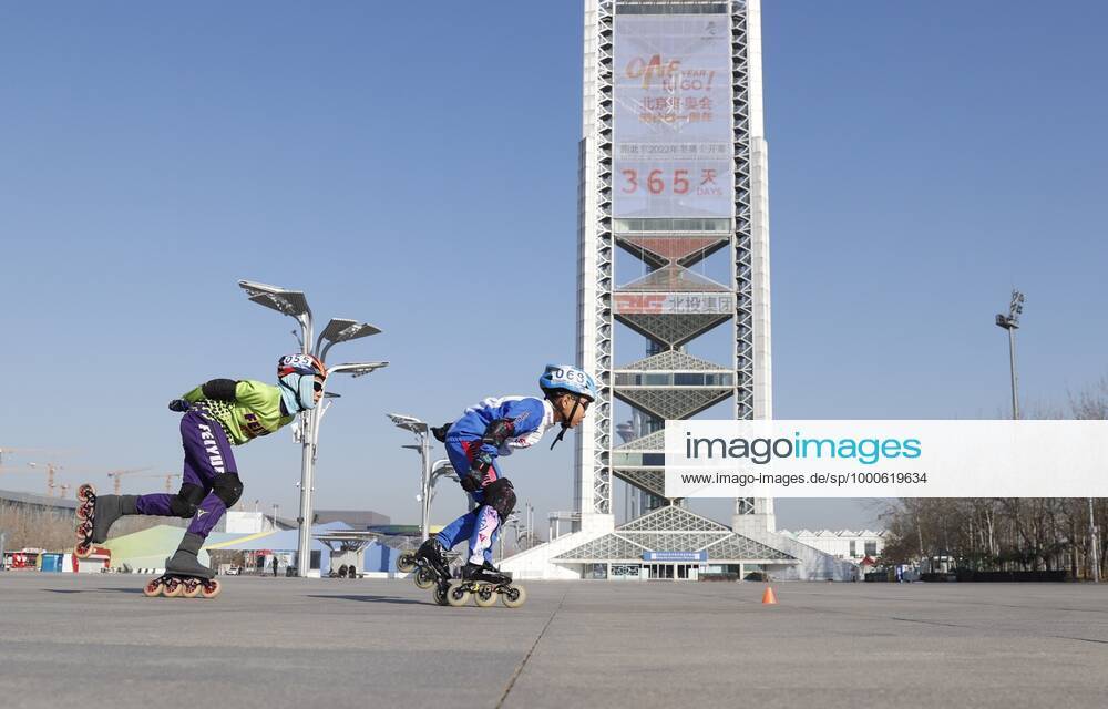 Children skate past a countdown clock for the Beijing 2022 Olympic Winter games, Winterspiele,Spiele, Summer games at Beijing Olympic Park on February 4, 2021 in Beijing, China. China on Thursday marks the one-year countdown to the 2022 Winter Olympics, which will open on February 4 next year.