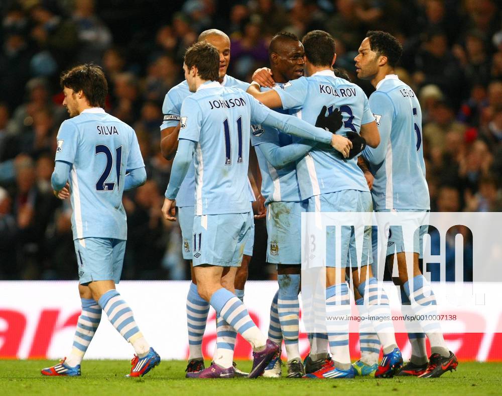 Football - Premier League - Manchester City vs. Blackburn Rovers Mario Balotelli of Manchester City is congratulated on his goal by team mates at the Etihad Stadium