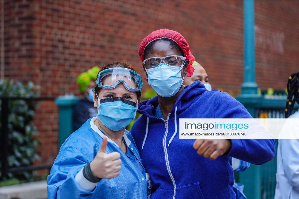Health professionals are honored by residents and firefighters outside a Manhattan hospital in New York City on Monday during the Coronavirus COVID-19 pandemic in the United States. New York USA - ZUMAc233 20200427_zsp_c233_050