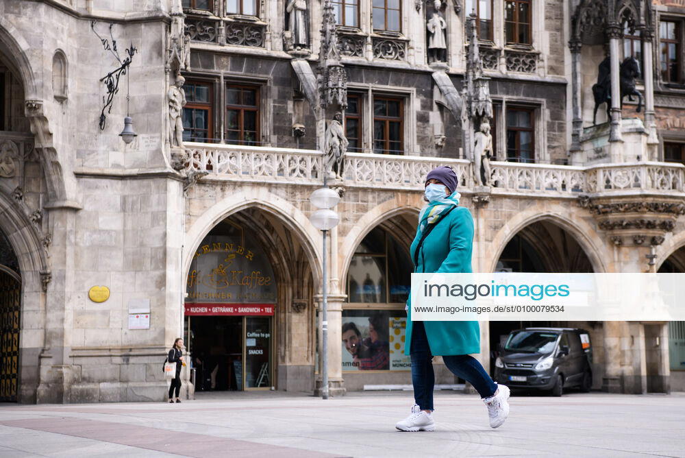(200428) -- MUNICH, April 28, 2020 (Xinhua) -- A pedestrian wearing a face mask is seen in Munich, Germany, April 27, 2020. In most German states, face masks or an equivalent mouth-and-nose cover have become mandatory on Monday when people travel by bus or train or go shopping. (Photo by Kevin Voigt Xinhua) GERMANY-MUNICH-COVID-19-FACE MASK