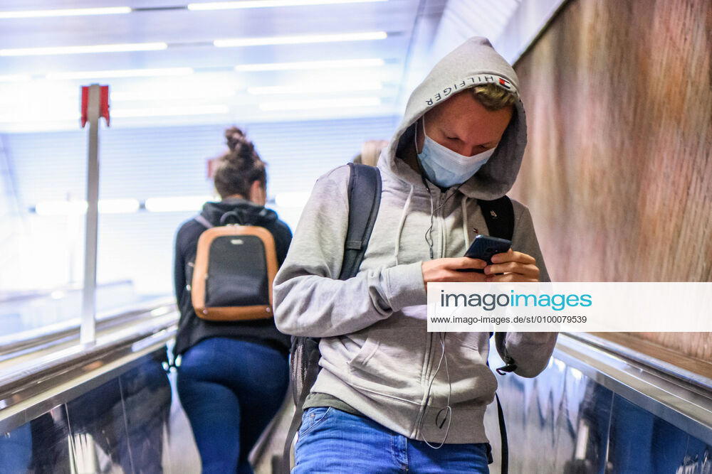 (200428) -- MUNICH, April 28, 2020 (Xinhua) -- A man wearing a face mask looks at his cellphone at a subway station in Munich, Germany, April 27, 2020. In most German states, face masks or an equivalent mouth-and-nose cover have become mandatory on Monday when people travel by bus or train or go shopping. (Photo by Kevin Voigt Xinhua) GERMANY-MUNICH-COVID-19-FACE MASK