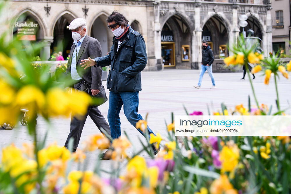 (200428) -- MUNICH, April 28, 2020 (Xinhua) -- Pedestrians wearing face masks are seen in Munich, Germany, April 27, 2020. In most German states, face masks or an equivalent mouth-and-nose cover have become mandatory on Monday when people travel by bus or train or go shopping. (Photo by Kevin Voigt Xinhua) GERMANY-MUNICH-COVID-19-FACE MASK