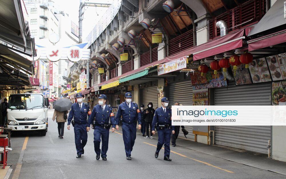 New coronavirus Police officers patrol Tokyo s Ameyoko shopping area on April 28, 2020, amid the coronavirus pandemic.
