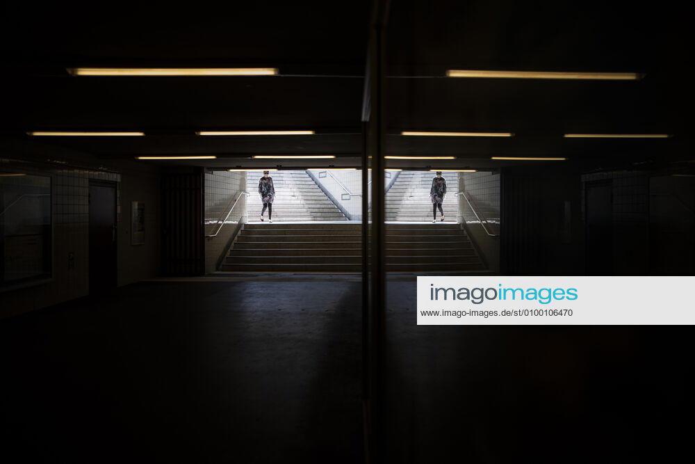 A woman with a face mask enters the underground station in Berlin, 28 04 2020 Germany-wide there is a mask obligation in public transport Berlin Germany