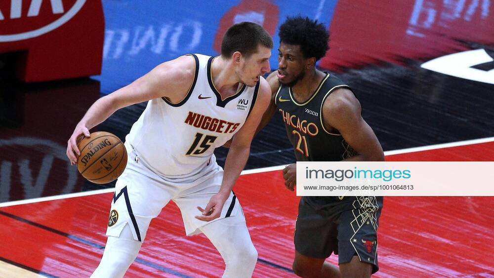 Denver Nuggets center Nikola Jokic (15) dribbles as Chicago Bulls forward Thaddeus Young (21) defends in the second quarter of a basketball game at the United Center in Chicago on Monday, March 1, 2021. - ZUMAm67_ 0114444051st