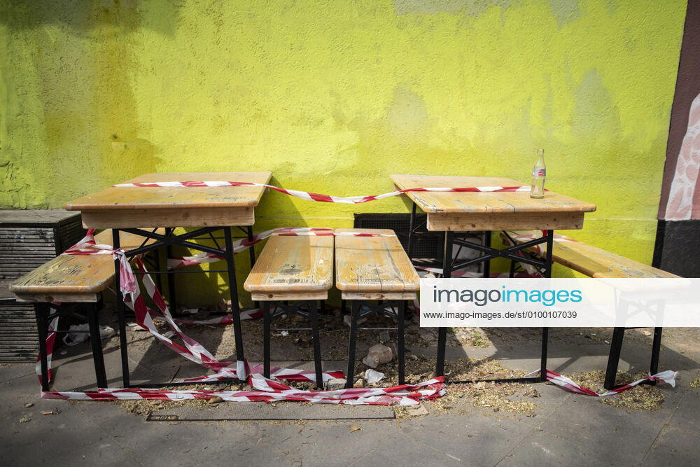 Benches and tables are cordoned off with barrier tape in Berlin, 28 04 2020 Due to the corona crisis, restaurateurs are not allowed to offer food for consumption on site, but only for take-away Berlin Germany