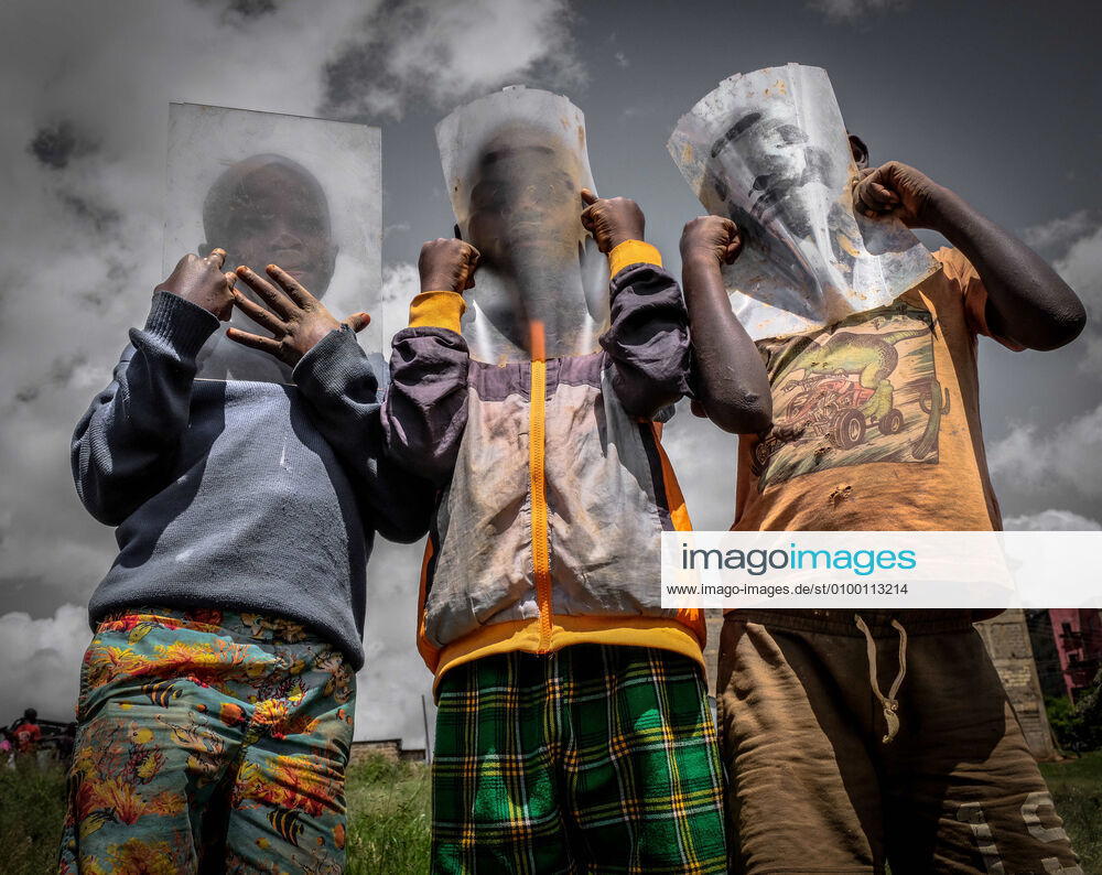 This is and and was life to most of us who could not afford to buy themselves facemasks. Young boys from Kibera Slums are seen protecting themselves from the Corona Virus using self made plastic facemasks. Nairobi Kenya - ZUMAd156 20200427_zip_d156_001