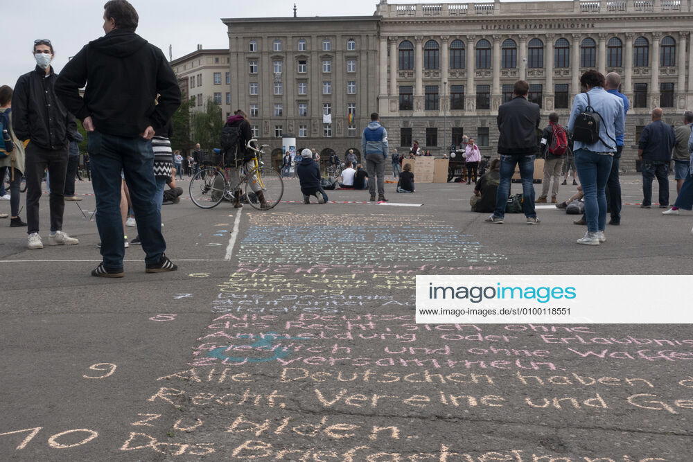 In Leipzig the constitution was painted with chalk on the floor in front of the Leipzig City Library while at a demonstration an open microphone was used for a corona debate for all there was Wilhelm Leuschner Platz Centre Saxony Germany