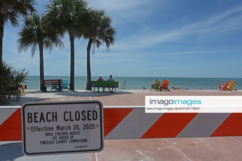 Beach visitors ignore closed beach signs and barricades on Pass-A-Grille Beach, St. Pete Beach, Wednesday, 4 28 2020. Pinellas County Commissioners voted to open the beaches Monday, with restrictions. St. Pete Beach USA - ZUMAs70_ 20200428_zan_s70_011