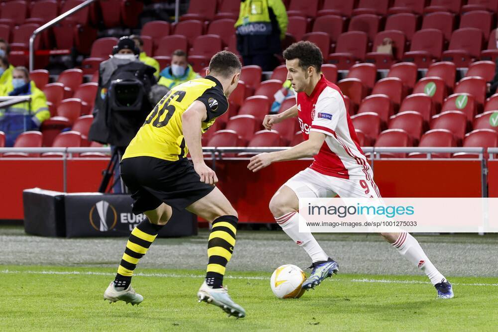 AMSTERDAM , 11}-03-2021 , Johan Cruijff Arena , Dutch football , Europa League , round of sixteen first leg , season 2020 2021. (R-L) Ajax player Oussama Idrissi and Young Boys player Silvan Hefti during the match Ajax vs Young Boys Ajax - Young Boys x11071739x