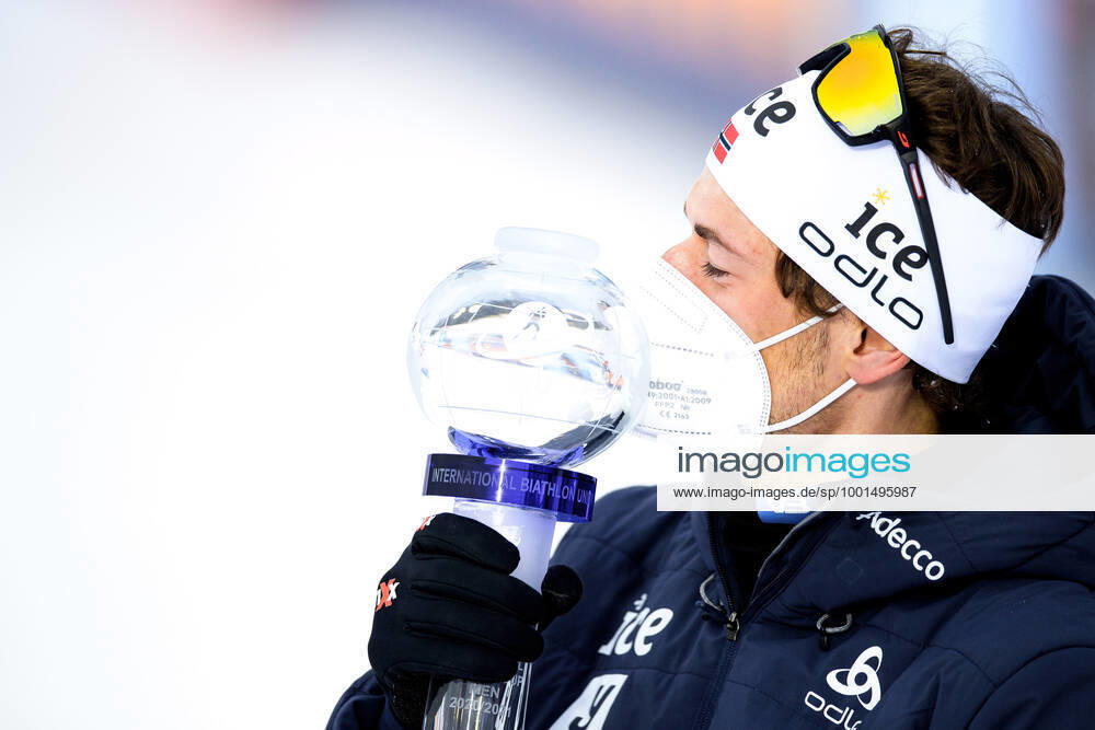Sturla Holm Laegreid of Norway celebrates with the trophy after the Men s 10 km Sprint during the IBU Biathlon World Cup on March 19, 2021 in Östersund Photo Joel Marklund BILDBYRAN code JM JM0085 bbeng biathlon biathlon biathlon world cup ibu world cup cheers,