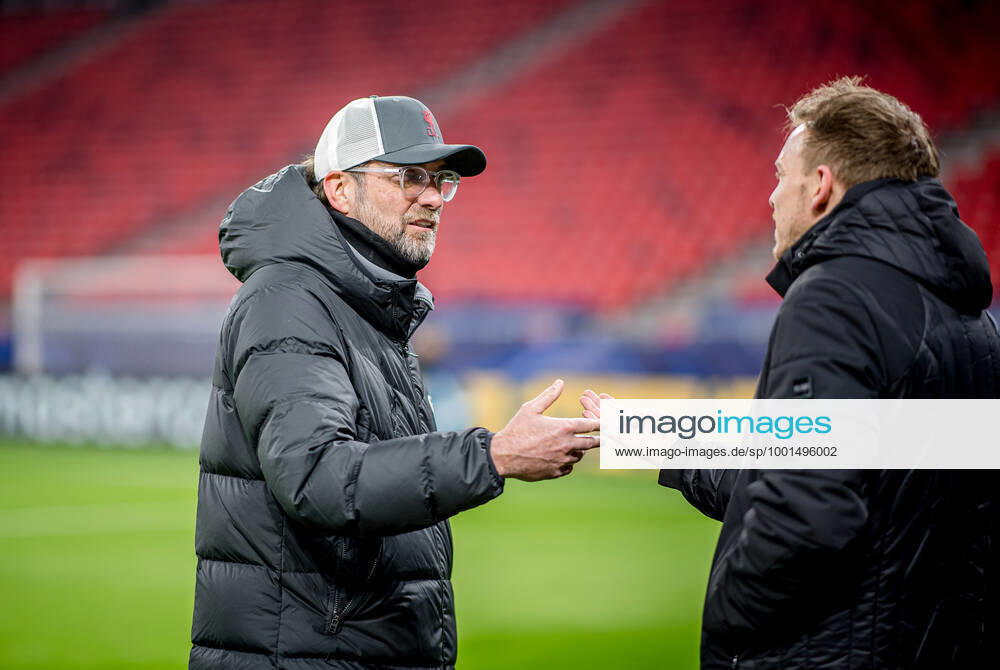Liverpool coach Juergen Klopp and Leipzig coach Julian Nagelsmann stand together and talk UEFA Champions League Round of 16, second leg FC Liverpool RB Leipzig 2 0 10 03 2021, Puskas Arena in Budapest Hungary FC Liverpool RB Leipzig