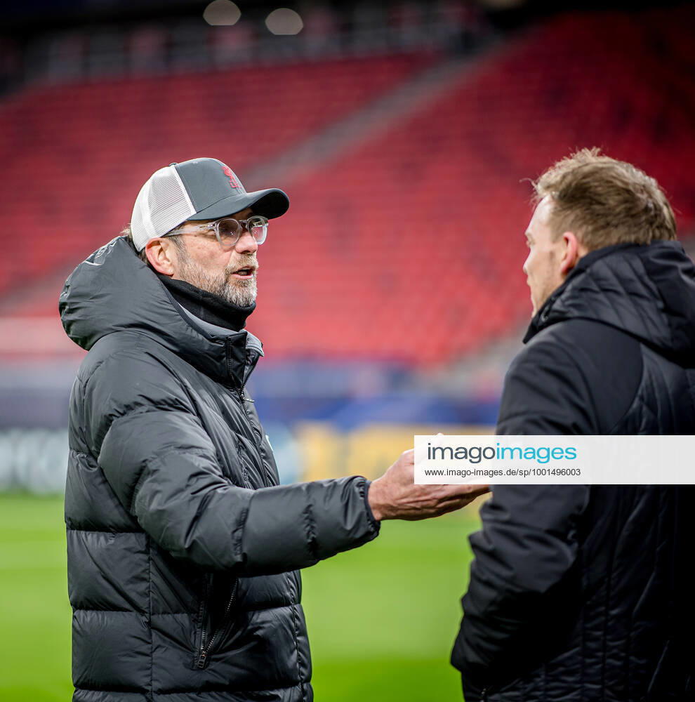 Liverpool coach Juergen Klopp and Leipzig coach Julian Nagelsmann stand together and talk UEFA Champions League Round of 16, second leg FC Liverpool RB Leipzig 2 0 10 03 2021, Puskas Arena in Budapest Hungary FC Liverpool RB Leipzig