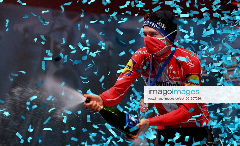 Winner Danish Kasper Asgreen of Deceuninck Quick Step celebrates on the podium with champagne after the E3 Saxo Bank Classic cycling race, 203, 9km from and to Harelbeke, Friday 26 March 2021 BELGA PHOTO DAVID STOCKMAN, HARELBEKE Denmark