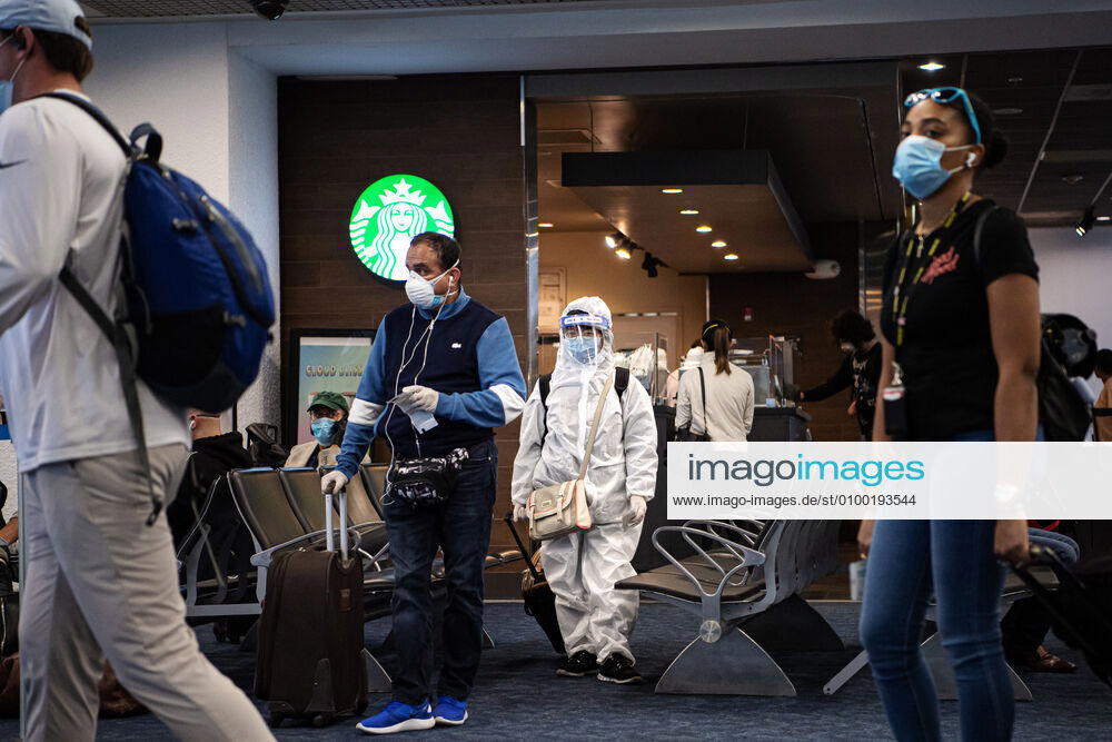 A woman in full protective gear waits to board a plane departing from Miami International Airport to New York LaGuardia Airport as the coronavirus, COVID 19, outbreak continues on April 30, 2020 in Miami, Florida, USA Photo Joel Marklund BILDBYRAN kod JM 88146 bbeng coronavirus covid 19 virus corona sjukdom flygplats travel resa,