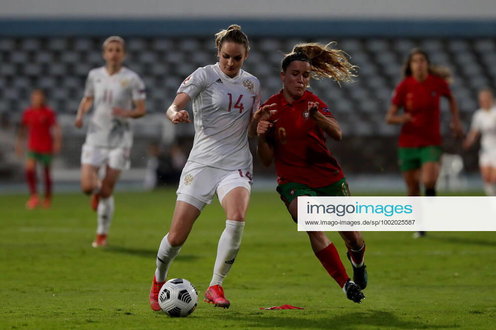Ana Capeta of Portugal (R ) vies with Anna Kozhnikova of Russia during the UEFA Women s EURO 2022 play-off first leg match between Portugal and Russia, at the Restelo stadium in Lisbon, Portugal, on April 9, 2021. Lisbon Portugal - ZUMAf123 20210409_zap_f123_007