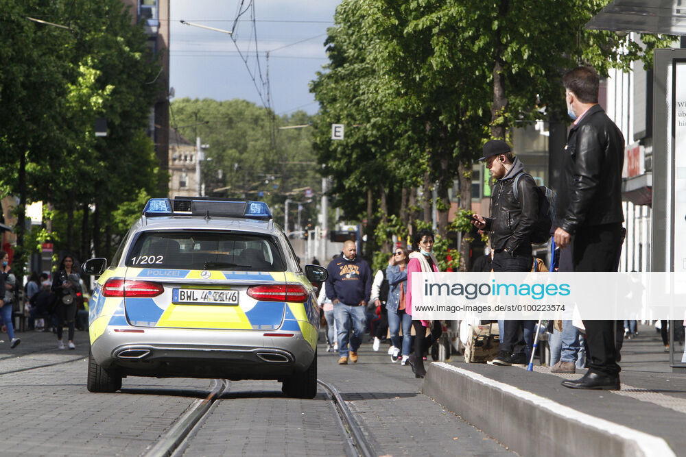 On the occasion of the Corona crisis, a police patrol of the state police of Baden Württemberg controls the observance of the contact prohibitions as well as minimum distances on the shopping street and pedestrian zone Planken in the city centre of Mannheim, Baden Württemberg, Germany, which has become highly frequented again after the reopening of the shops.