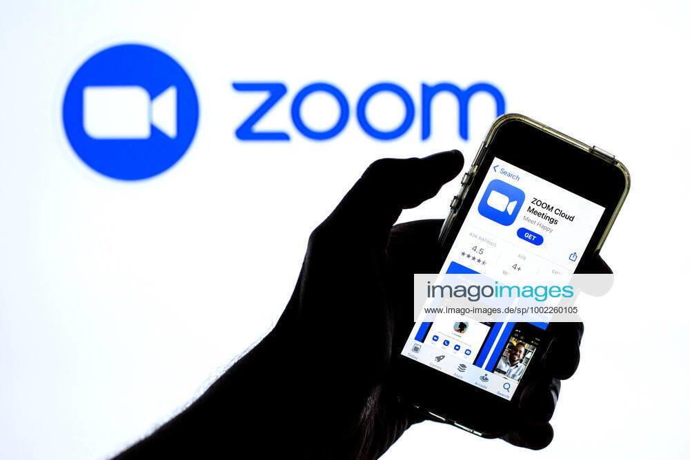 In this photo illustration a Zoom app in App Store seen displayed on a smartphone with the Zoom logo in the background. Barcelona Spain - ZUMAd159 20210420_zia_d159_115